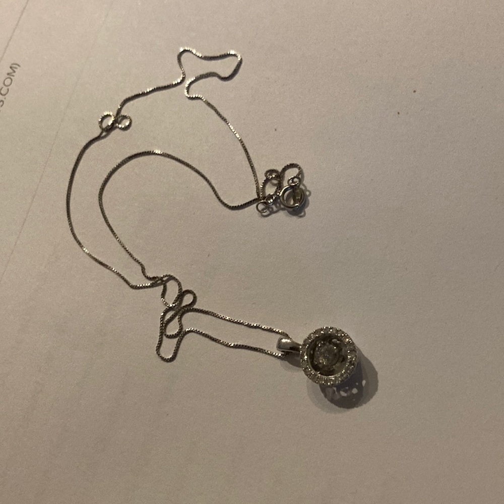 14K WG dancing diamond pendant necklace. Valued at Kay Jewelers for $1400.